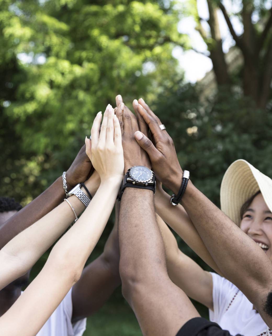 front-view-interracial-friends-cheering-scaled